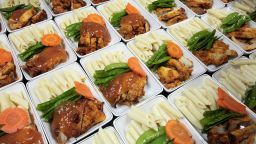 HANOI, VIETNAM - 2010/06/23: Main course dishes being prepared for airline passengers at Noi Bai Food Company. Everyday the company processes about 2 tons of food for the airlines that fly into Hanoi's International Airport. . (Photo by Chau Doan/LightRocket via Getty Images)