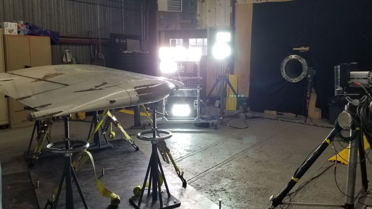A chicken cannon is used to test an aircraft wing.