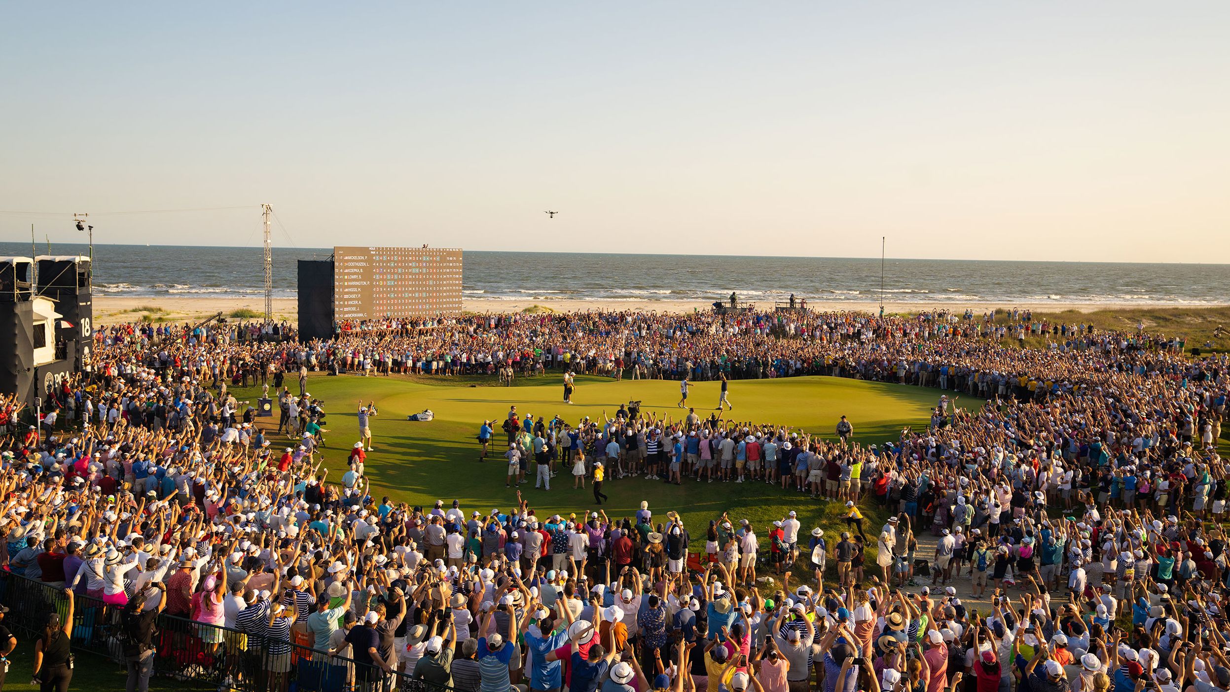 <strong>May 23: </strong>Crowds swarm the 18th green at the Ocean Course of Kiawah Island Golf Resort as Mickelson makes his final putt to win the PGA Championship. In doing so the 50-year-old created golf history.