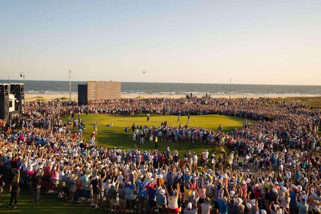 <strong>May 23: </strong>Crowds swarm the 18th green at the Ocean Course of Kiawah Island Golf Resort as Mickelson makes his final putt to win the PGA Championship. In doing so the 50-year-old created golf history.
