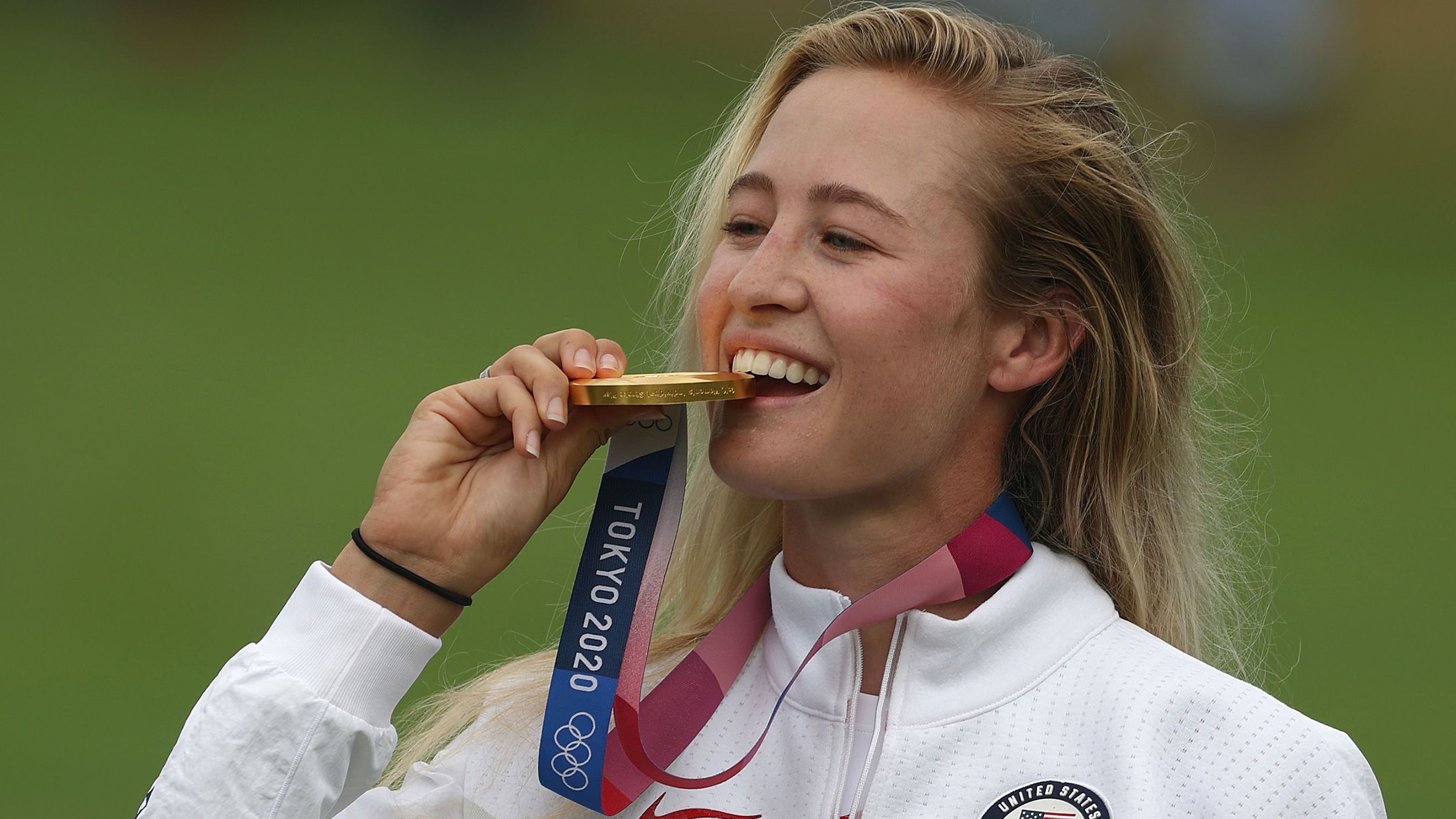 <strong>August 7: </strong>Nelly Korda bites into the gold medal after claiming first place at the Tokyo 2020 Olympics. It continued her excellent season after winning her first major earlier in the year. 