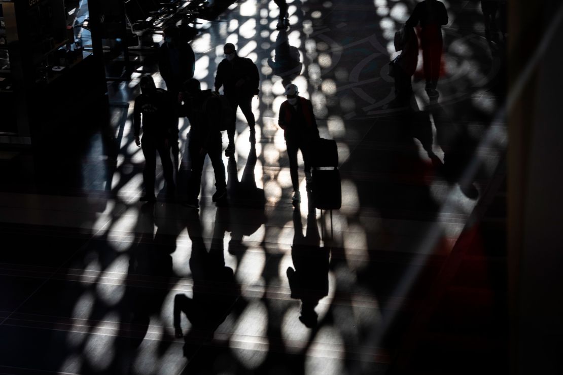 Travelers walk through the main concourse at Reagan National Airport in Arlington, Virginia, on November 23 during the Thanksgiving holiday period.