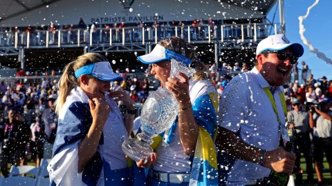 Team Europe's Matilda Castren and Madelene Sagstrom celebrate with the Solheim Cup.