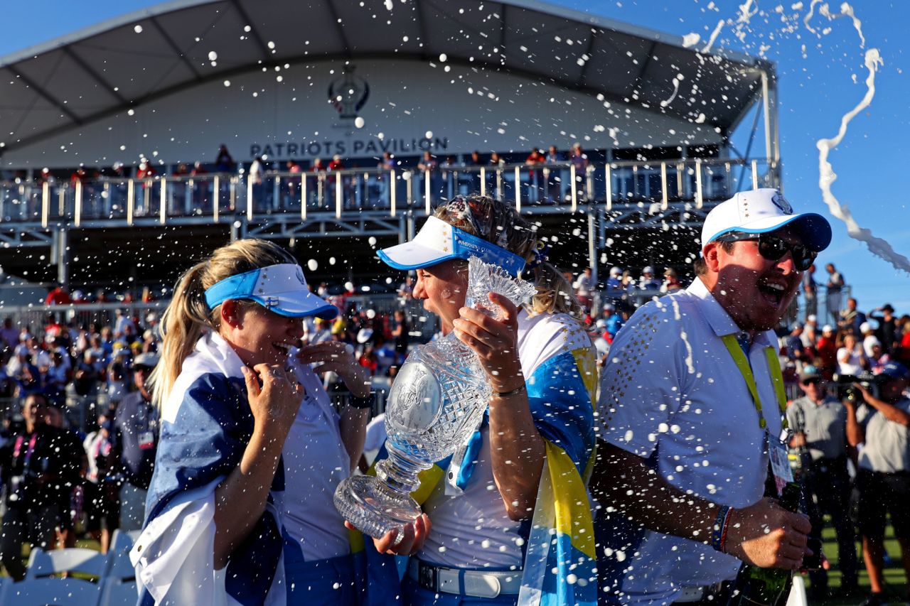<strong>September 6:</strong> Matilda Castren and Madelene Sagstrom celebrate with the Solheim Cup after claiming a famous victory over Team USA  at the Inverness Club in Toledo, Ohio. Rookie Castren rolled home the winning putt.