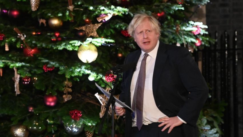 Britain's Prime Minister Boris Johnson makes a speech as he visits a UK Food and Drinks market set up in Downing Street on November 30, 2021 in London, England.