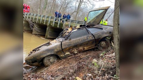 Investigators pull a 1974 Ford Pinto from a creek in Alabama.