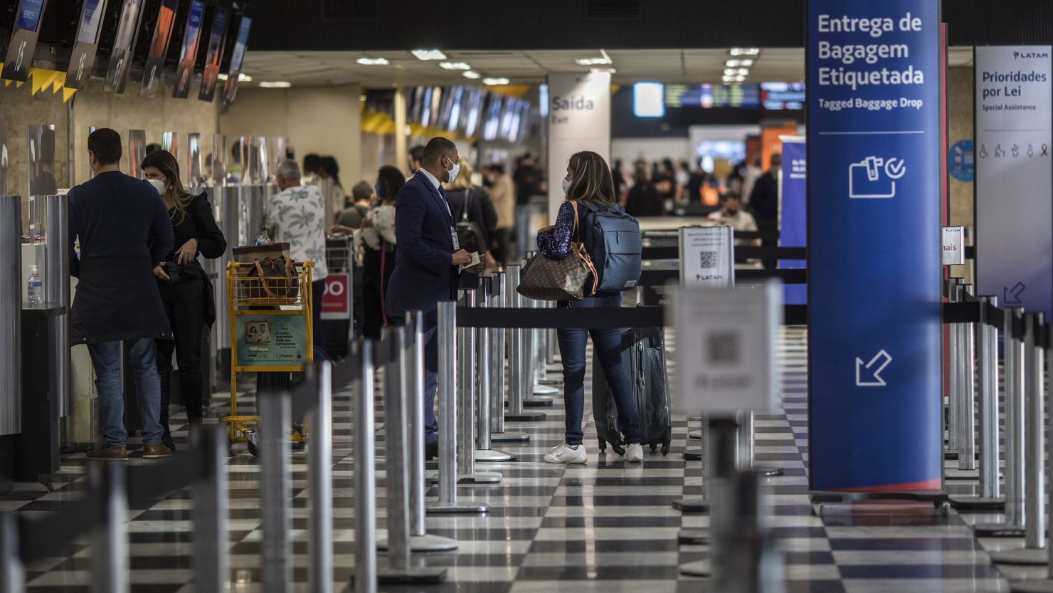 Travelers check-in at Congonhas Airport  in Sao Paulo, Brazil, in August. It is one of 16 airports to be auctioned next year.
 