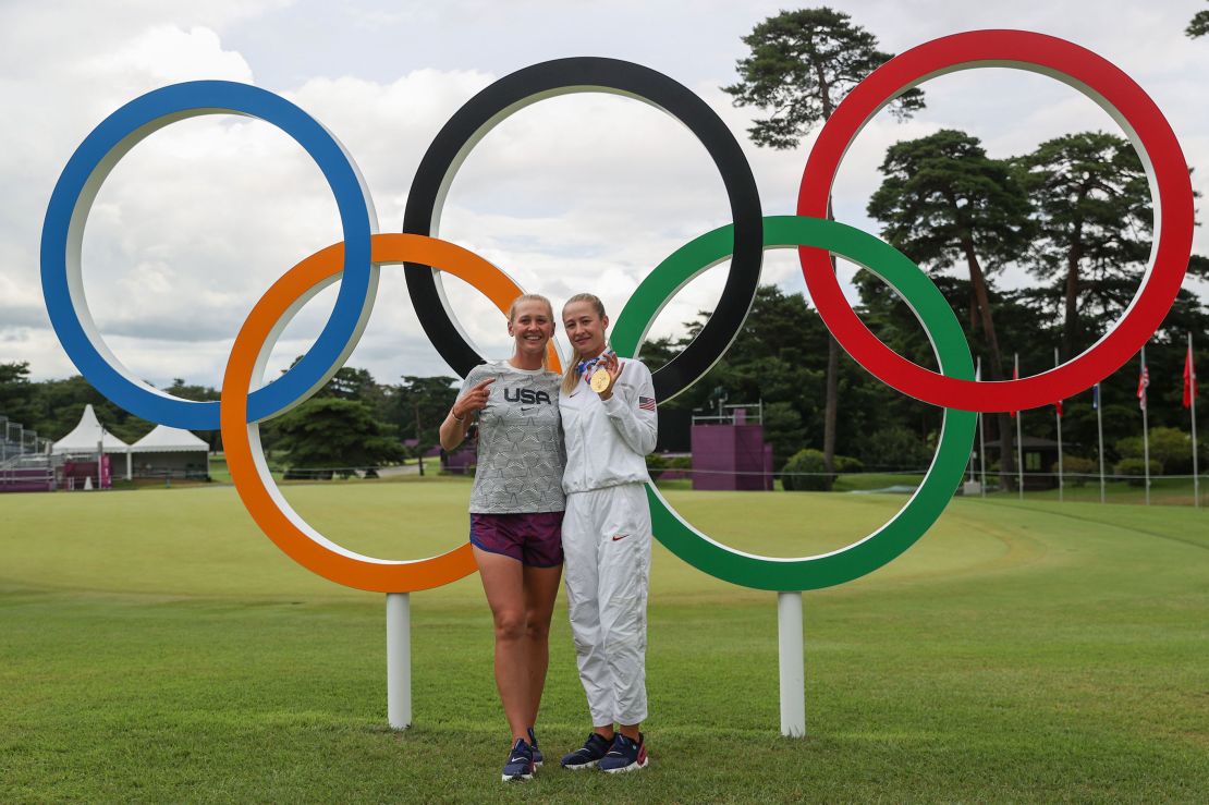 Nelly poses with her sister Jessica after winning the gold medal at the Tokyo 2020 Olympic Games.