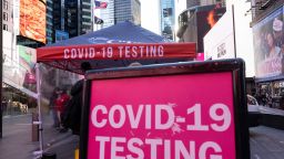 A sign of COVID-19 testing site is seen in Times Square on Friday, Dec. 3, 2021, in New York. The omicron variant of COVID-19, which had been undetected in the U.S. before the middle of this week, had been discovered in at least five states by the end of Thursday, showing yet again how mutations of the virus can circumnavigate the globe with speed and ease.(AP Photo/Yuki Iwamura)