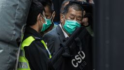 Media tycoon Jimmy Lai is escorted into a Hong Kong Correctional Services van outside the Court of Final Appeal in Hong Kong on February 1, 2021.