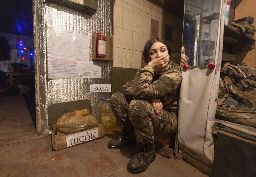 A Ukrainian soldier rests near a fighting position on the line of separation from pro-Russian rebels near Katerinivka, Ukraine, on December 7.