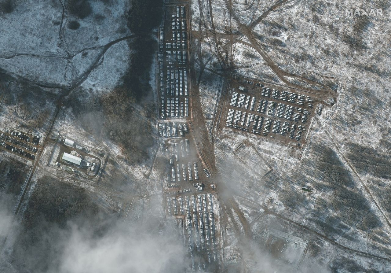 This satellite image shows Russian troops in Yelna, Russia, on November 9. <a href="https://www.cnn.com/2021/11/04/europe/russia-ukraine-military-buildup-intl-cmd/index.html" target="_blank">Satellite photos</a> taken that month revealed Russian hardware -- including self-propelled guns, battle tanks and infantry fighting vehicles -- on the move at a training ground roughly 186 miles (300 km) from the border.