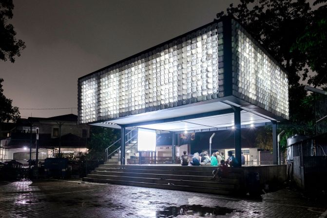Using ice cream containers to form the building's facade, the <a href="index.php?page=&url=https%3A%2F%2Fshau.nl%2Fen%2Fproject%2F53" target="_blank" target="_blank">Microlibrary</a> in Bandung, Indonesia, was designed by Dutch studio SHAU in 2016 as a communal reading space. The architects hollowed out the base of some of the containers to create the illusion of color, arranging them in binary code to spell out, "Books are the windows to the world."