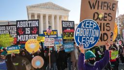 WASHINGTON, DC - DECEMBER 01: Demonstrators gather in front of the U.S. Supreme Court as the justices hear arguments in Dobbs v. Jackson Women's Health, a case about a Mississippi law that bans most abortions after 15 weeks, on December 01, 2021 in Washington, DC. With the addition of conservative justices to the court by former President Donald Trump, experts believe this could be the most important abortion case in decades and could undermine or overturn Roe v. Wade. (Photo by Chip Somodevilla/Getty Images)