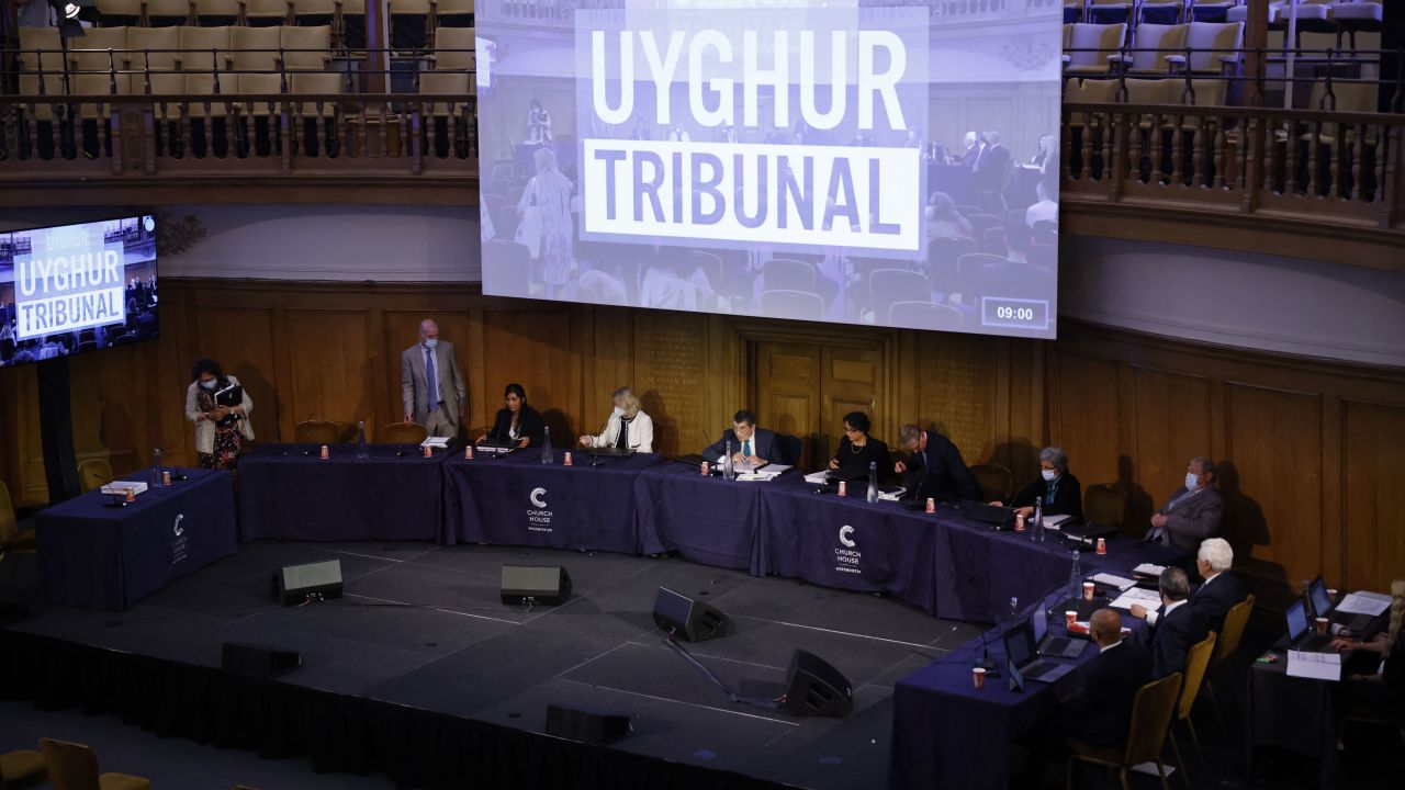 Members of the panel take their seats for the first day of hearings at the Uyghur Tribunal on June 4, 2021.