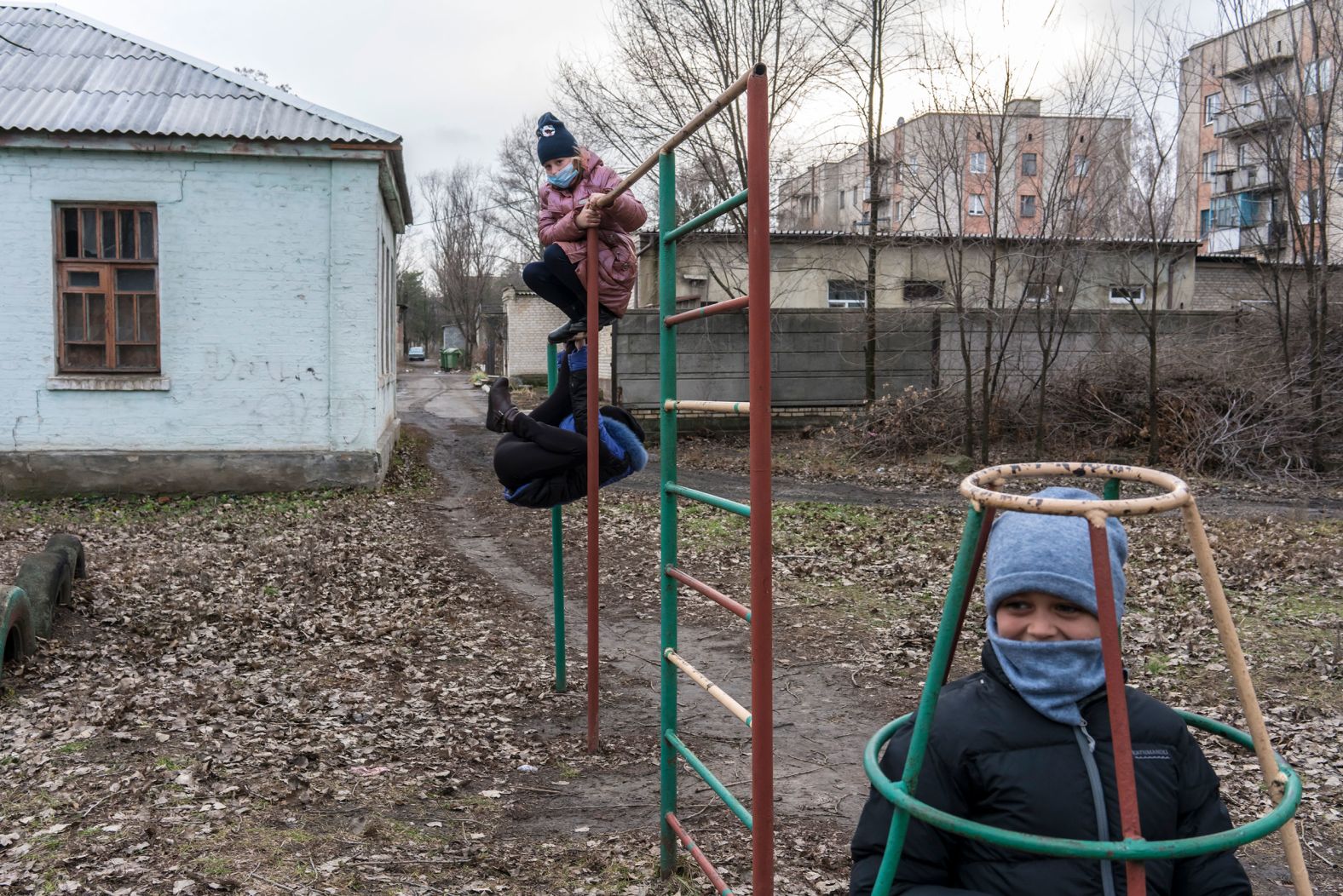 Students play while waiting for the bus after school in Krasnohorivka, Ukraine, on December 8.