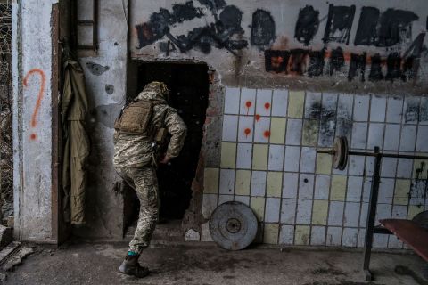A Ukrainian soldier enters a building in Avdiivka, Ukraine, on Wednesday, December 1.