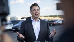 Tesla head Elon Musk talks to the press as he arrives to to have a look at the construction site of the new Tesla Gigafactory near Berlin on September 03, 2020 near Gruenheide, Germany. Musk is currently in Germany where he met with vaccine maker CureVac on Tuesday, with which Tesla has a cooperation to build devices for producing RNA vaccines, as well as German Economy Minister Peter Altmaier yesterday. 