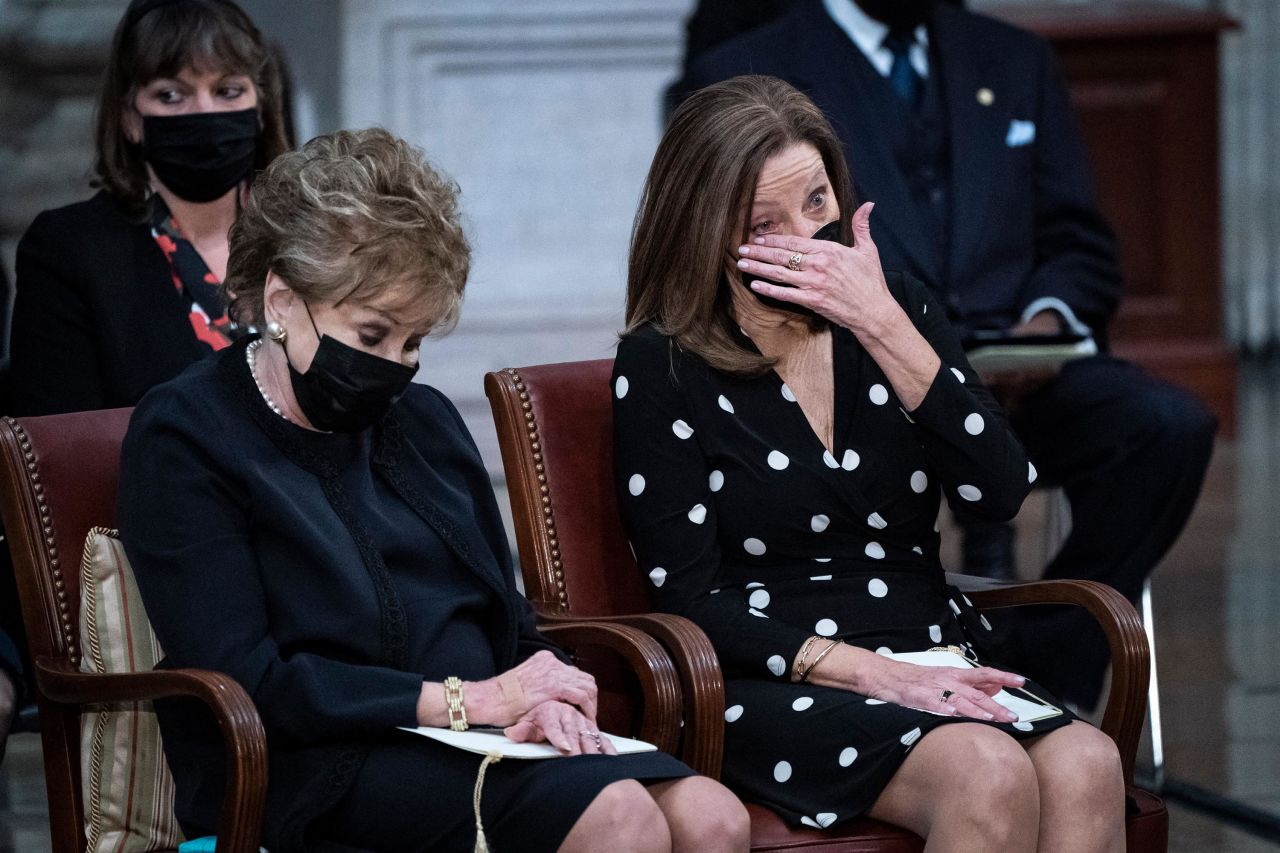 Dole's wife, Elizabeth, and daughter, Robin, listen during the congressional ceremony.