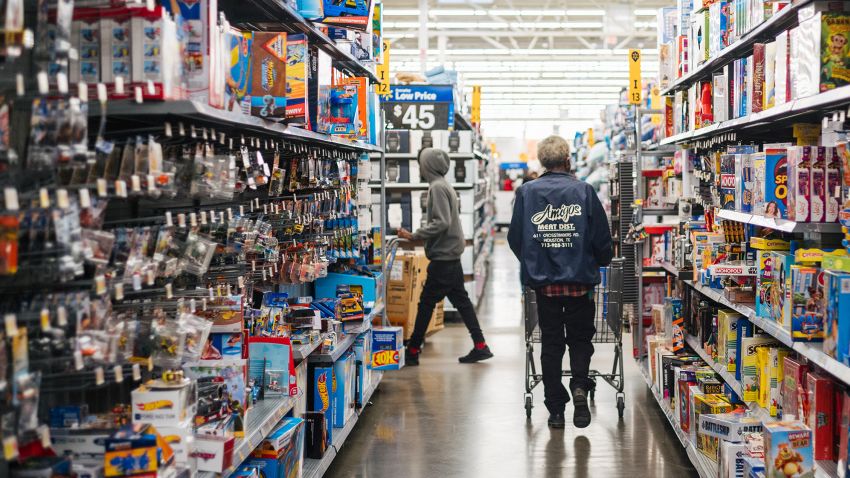 People shop in a Walmart store during Black Friday on November 26, 2021 in Houston, Texas.