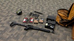 The suspect's backpack contained a collapsible rifle and a magazine.