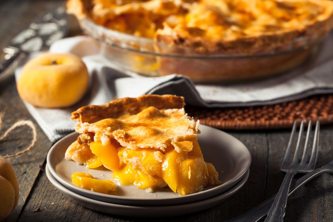 This homemade warm peach pie is ready to eat.