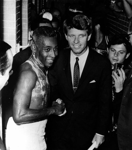 A soapy Pelé shakes hands with US Sen. Robert F. Kennedy after a match in Rio de Janeiro in 1965.