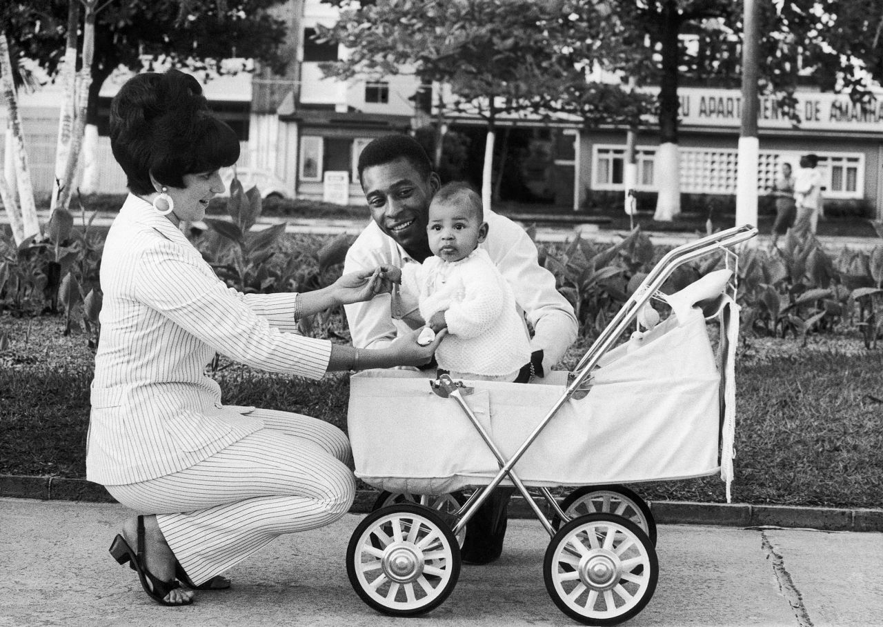 Pelé and his wife, Rosemeri, instrumentality     their young daughter, Kely, retired  for a locomotion  successful  1967. It was their archetypal  kid  together. They would person  3  children successful  each  earlier  divorcing successful  1978.