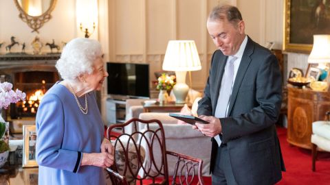 The Queen presents organist Thomas Trotter with the Queen's Medal for Music, during an audience at Windsor Castle.