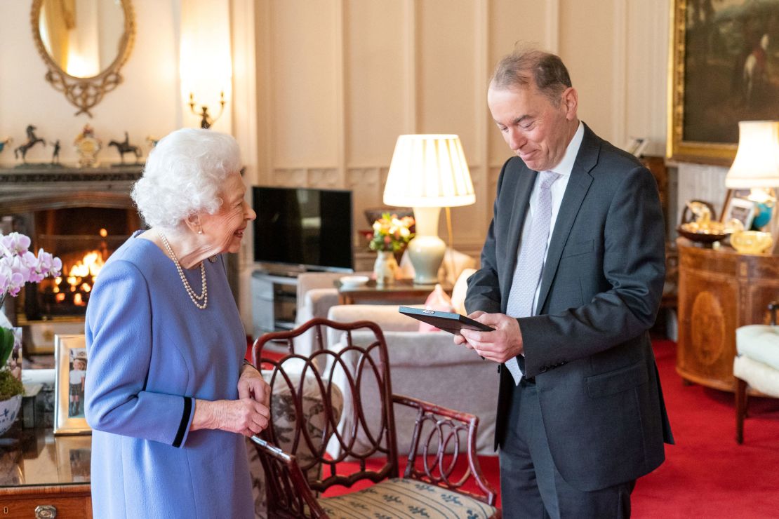 The Queen presents organist Thomas Trotter with the Queen's Medal for Music, during an audience at Windsor Castle.