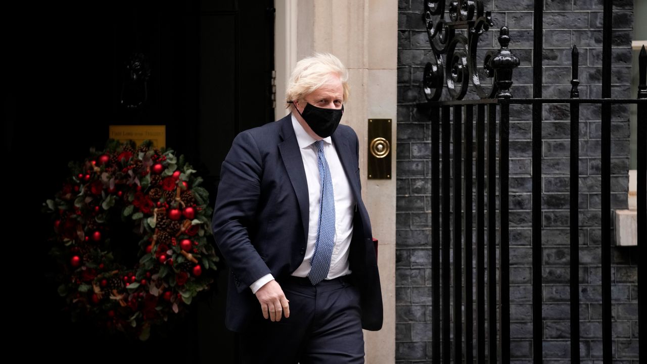British Prime Minister Boris Johnson leaves 10 Downing Street to attend the weekly Prime Minister's Questions at the Houses of Parliament, in London, 8 December.