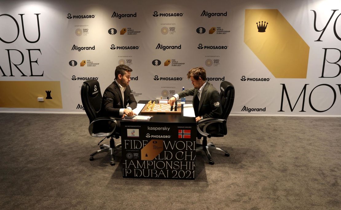 Russia's Ian Nepomniachtchi, left, and Norway's Magnus Carlsen compete during Game 11.