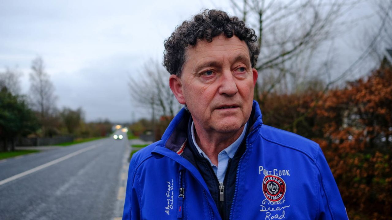 Councillor Johnny Flynn stands on the Tulla Road, which runs parallel to the proposed data center site in Ennis.