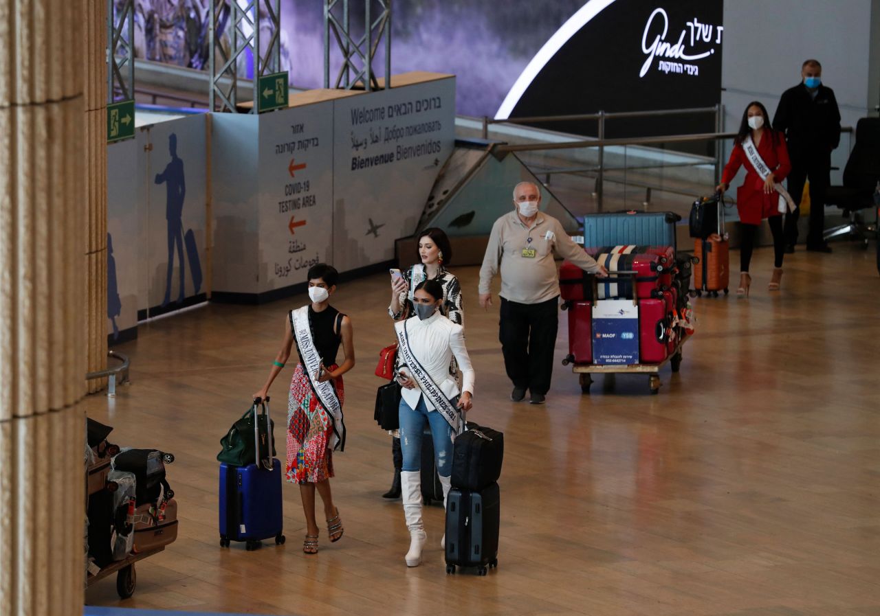 Miss Universe contestants arrive at Israel's Ben Gurion Airport in Lod, east of Tel Aviv, on November 28, 2021.