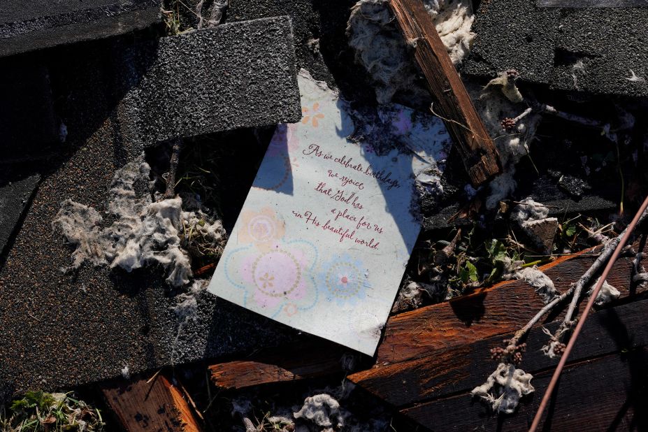 A birthday card lies among the debris in Mayfield.