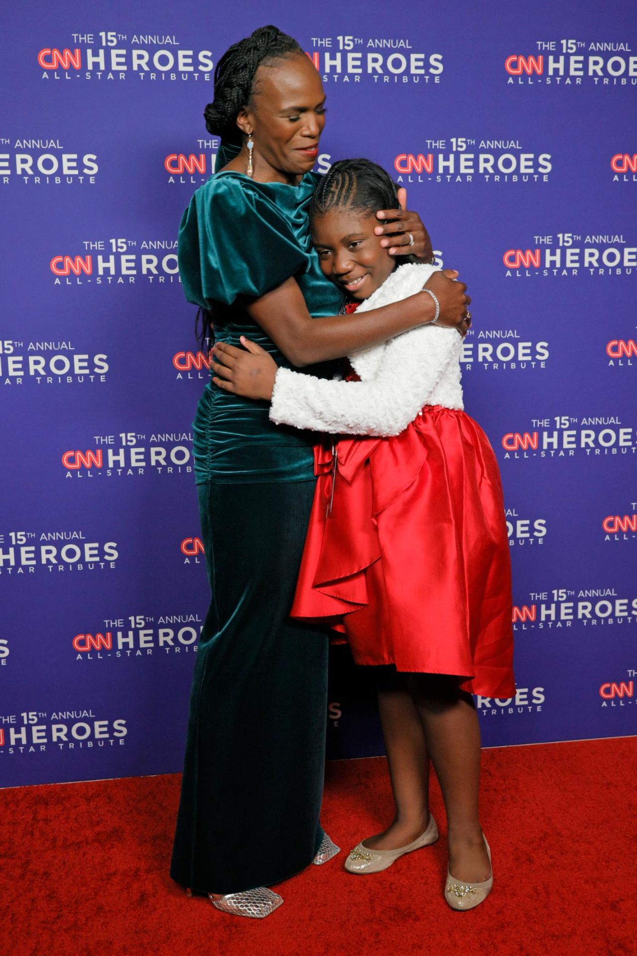 2021 <a href="https://www.cnn.com/2021/06/24/health/philadelphia-black-doctors-covid-19-vaccination-cnnheroes/index.html" target="_blank">CNN Hero Dr. Ala Stanford</a> embraces 2021 Young Wonder Chelsea Phaire.
