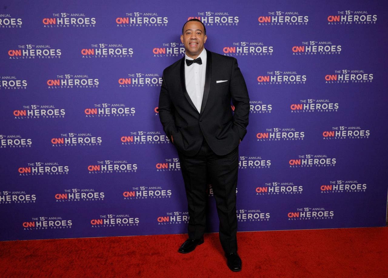 2021 <a href="https://www.cnn.com/2021/05/20/us/fitness-training-coach-workout-prison-cnnheroes/index.html" target="_blank">CNN Hero Hector Guadalupe</a> poses on the red carpet.