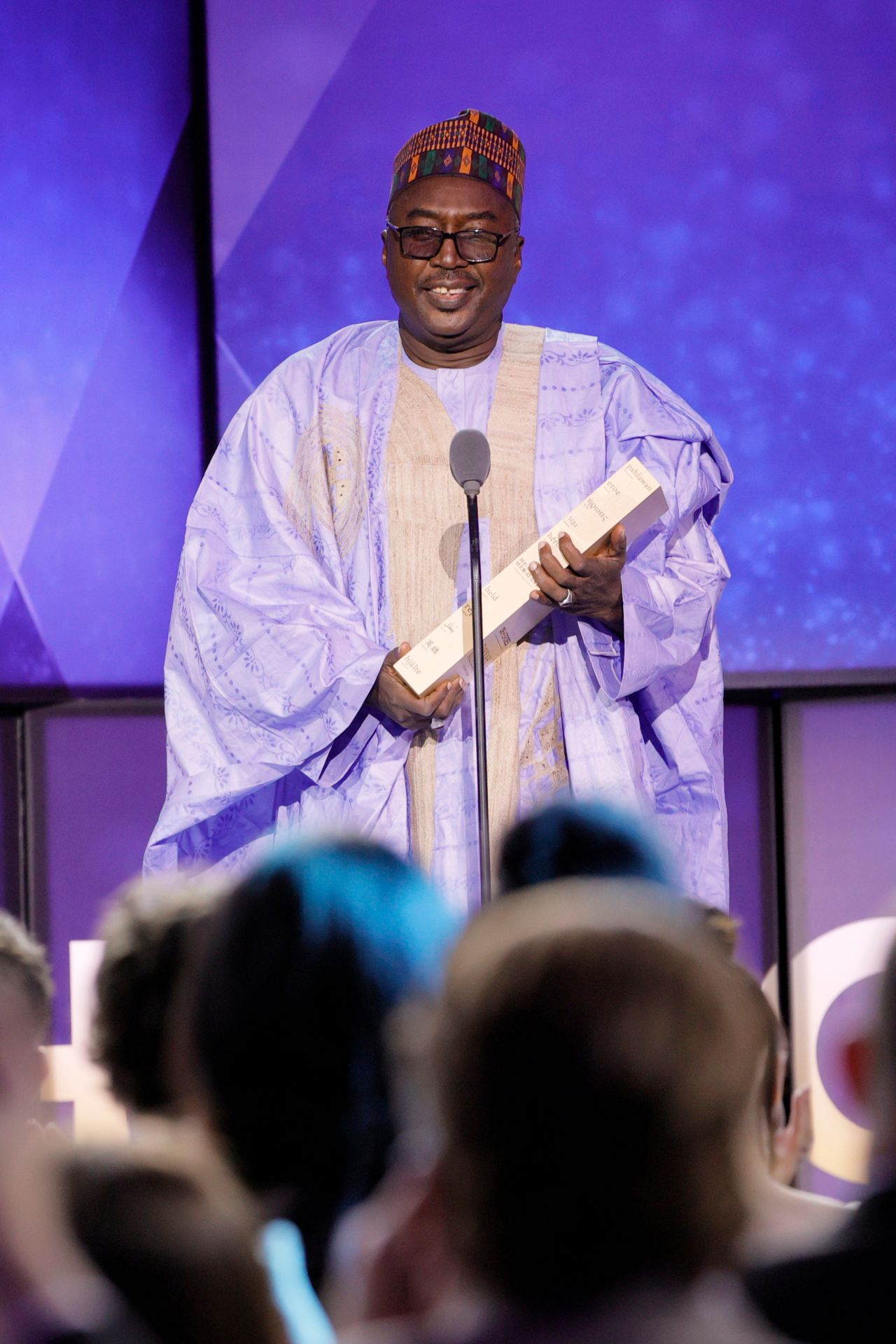 2021 CNN Hero Zannah Mustapha accepts his award onstage. For more than a decade, Mustapha has devoted his life to providing hope and peace for children caught in the epicenter of the Boko Haram insurgency. Today, Mustapha and his staff educate more than 2,000 students from both sides of the conflict at the <a href="https://futureprowess.org/" target="_blank" target="_blank">Future Prowess Islamic Foundation School</a> in Maiduguri.