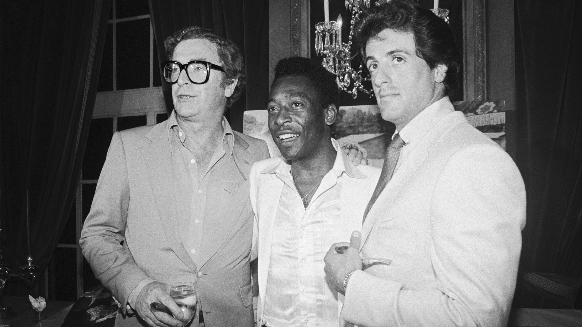 Pelé attends a party with actors Michael Caine, left, and Sylvester Stallone. The three starred together in the 1981 film "Escape to Victory."