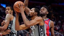 Brooklyn Nets forward Kevin Durant (7) attempts a layup as Detroit Pistons center Isaiah Stewart defends during the second half of an NBA basketball game, Sunday, Dec. 12, 2021, in Detroit. 