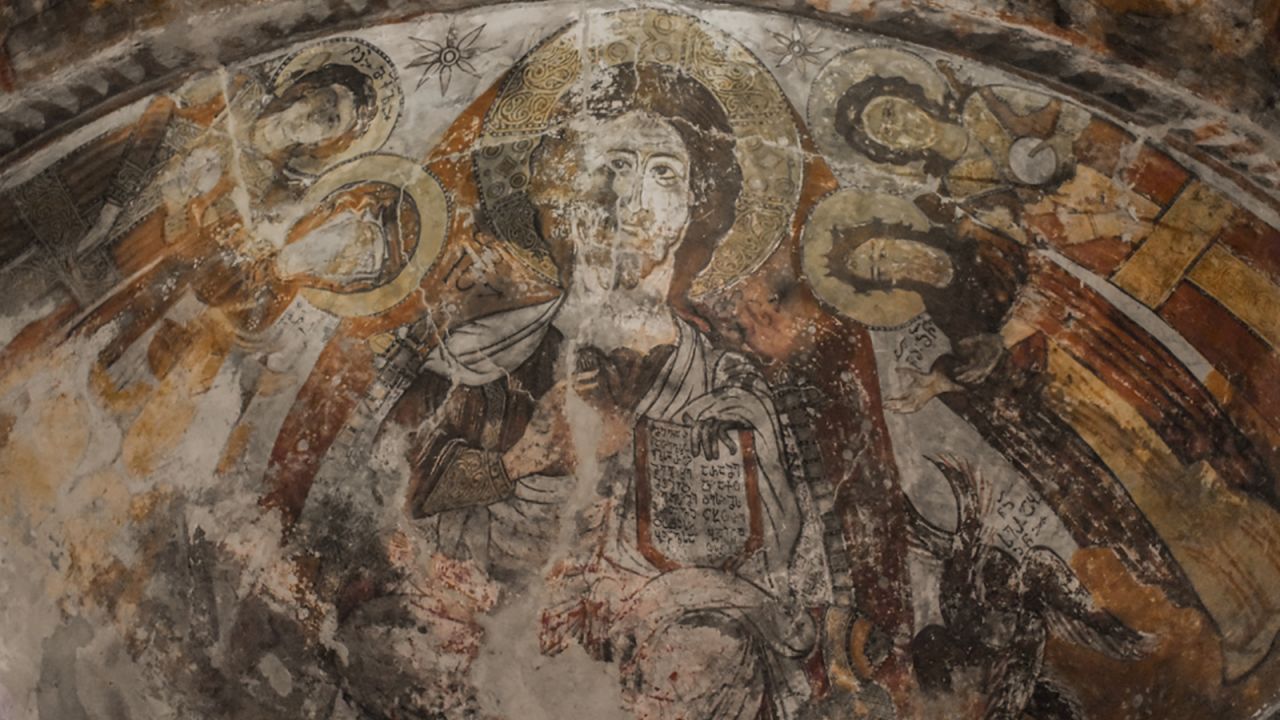 <strong>Lamaria: </strong>On a lone Ushguli hill sits Lamaria, a humble 10th century orthodox Christian church named for the ancient Svan goddess. The inside of the church features distressed frescoes.  