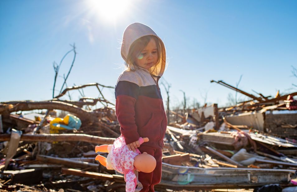 Desiray Cartledge, 3, stands in the rubble of her house in Dawson Springs, Kentucky, on December 12. 