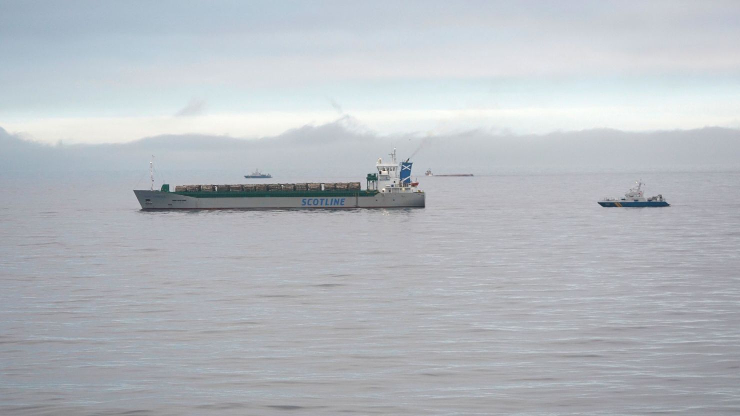 The Scot Carrier (left) and the capsized cargo ship Karin Hoej (center, background) are pictured in the Baltic Sea, between the Swedish city of Ystad and the Danish island of Bornholm, after their collision.
