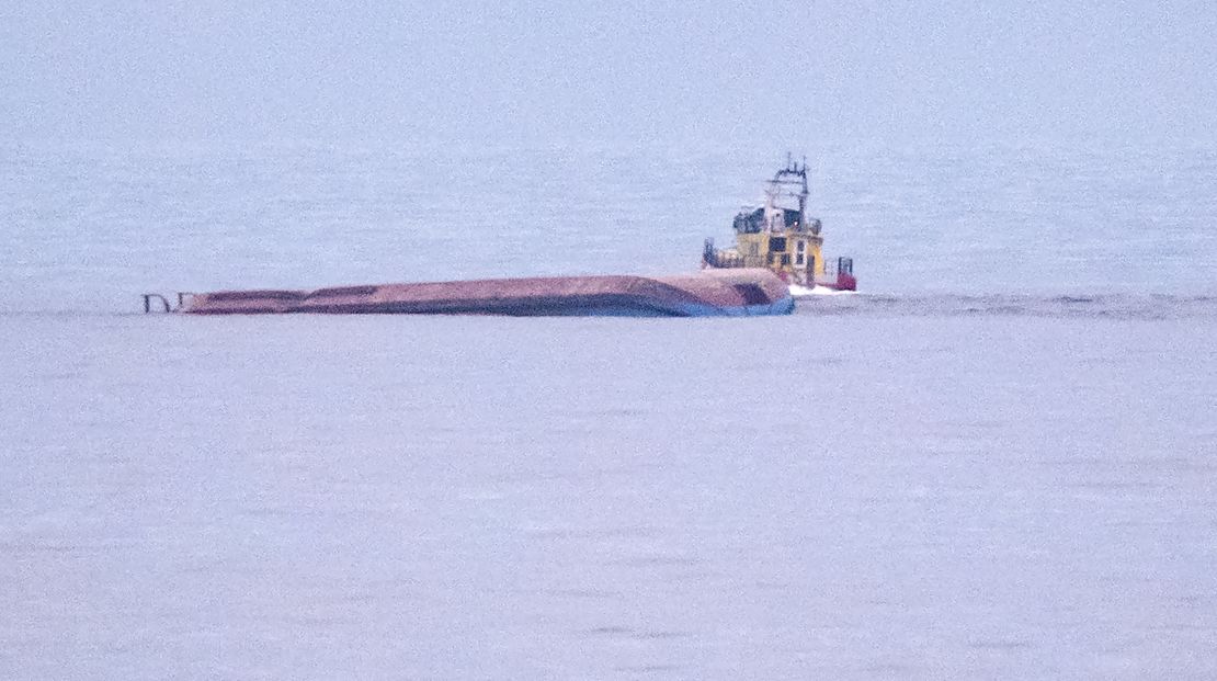 The capsized Danish cargo ship Karin Hoej (left) is seen on the Baltic Sea.