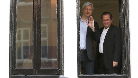 Assange appears with Ecuadorian Foreign Minister Ricardo Patino on the balcony of the embassy in June 2013.