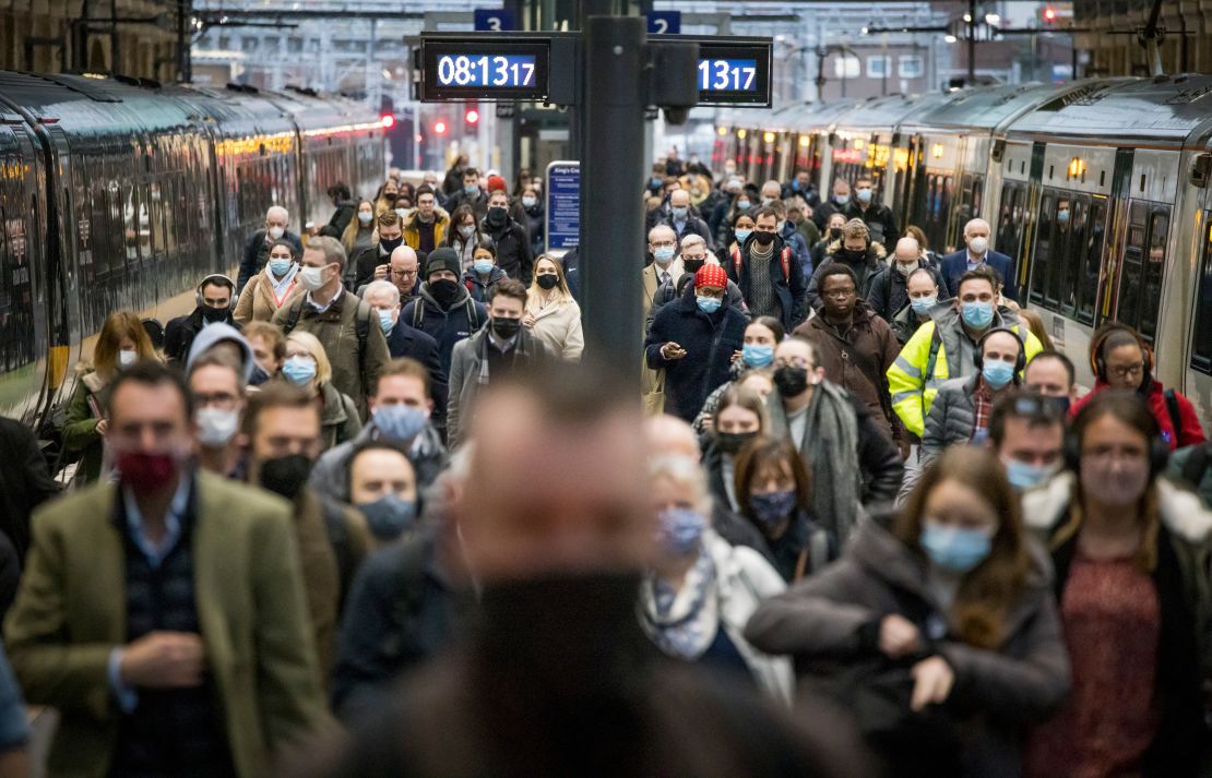 Commuters at London's Kings Cross station after the return of the mask mandate.