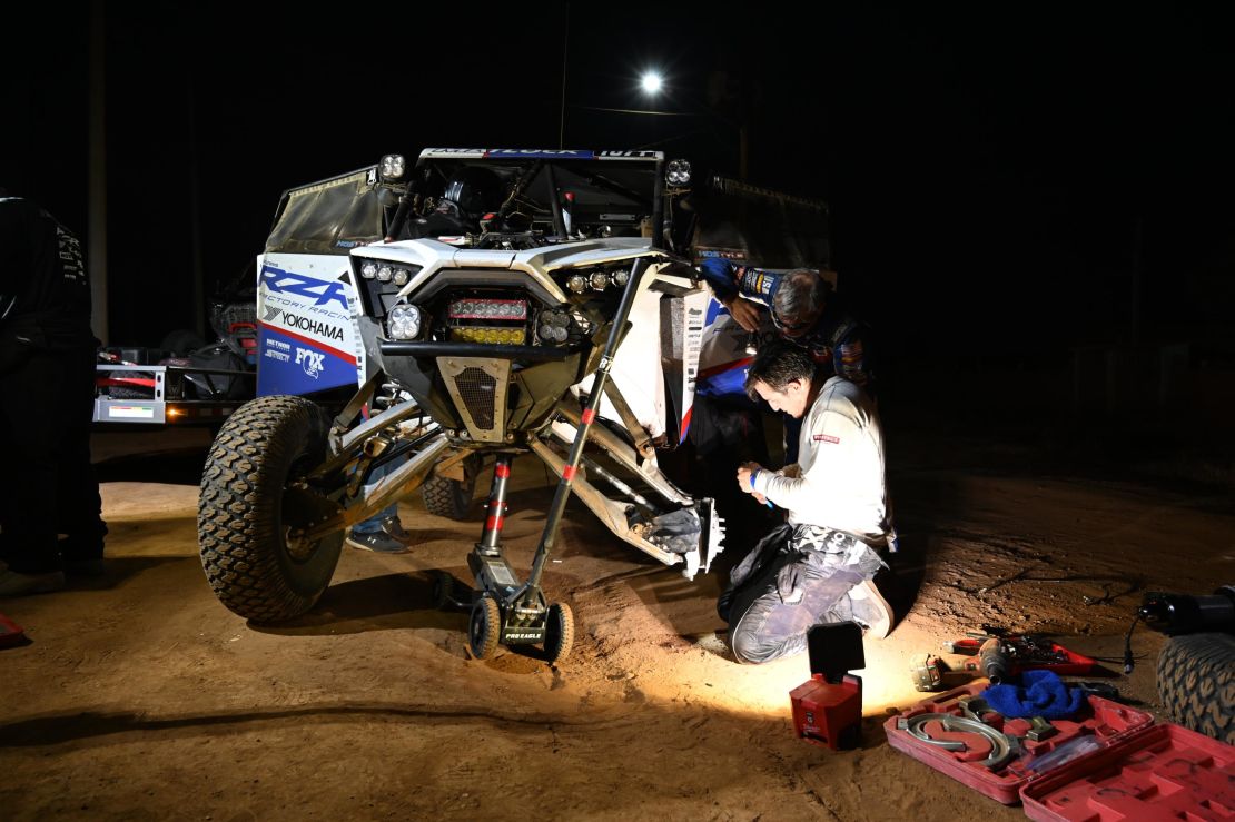 Repairs -- a frequent necessity in the Baja 1000 -- often have to be done at night.