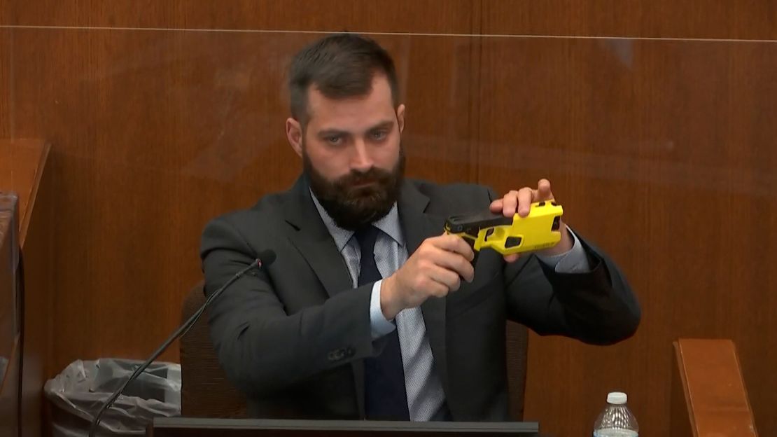 Special agent Sam McGinnis of the Minnesota Bureau of Criminal Apprehension explains the differences between Kim Potter's service weapon and a Taser.