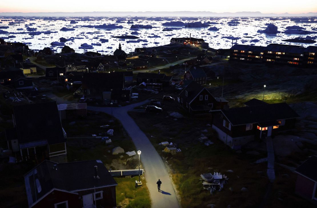 Ice and icebergs float in the distance in Disko Bay in September 2021 in Ilulissat, Greenland.