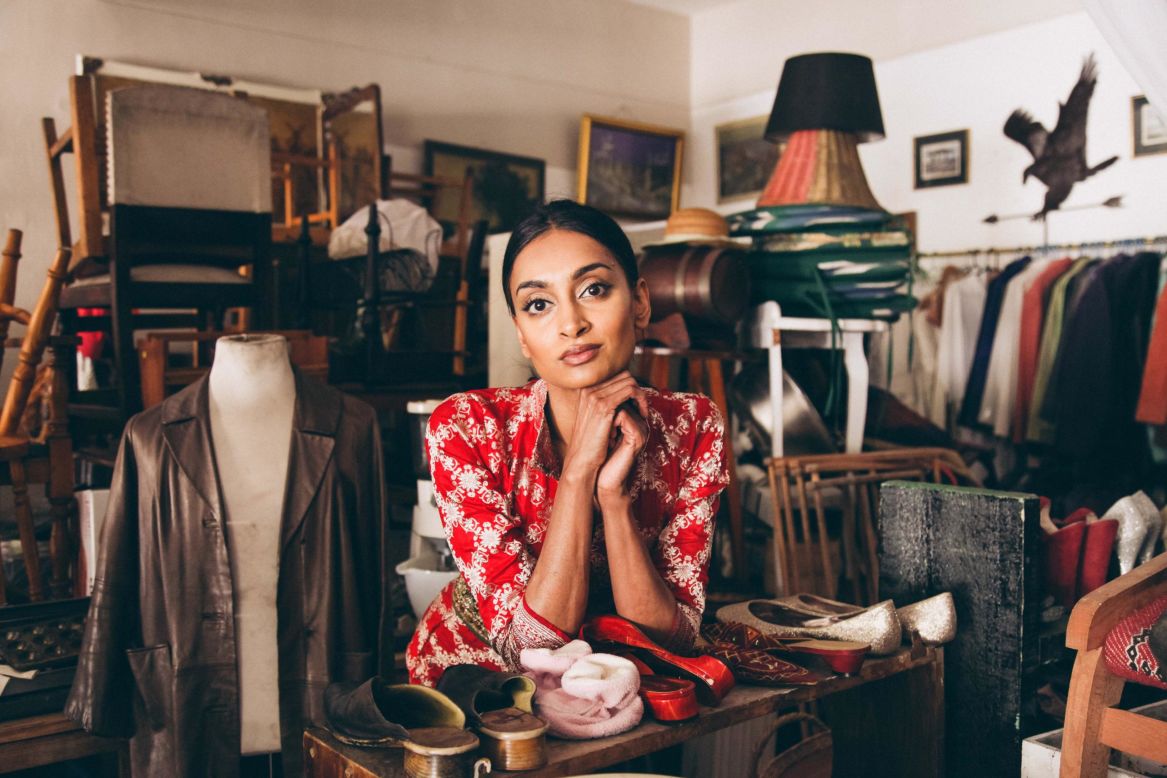 Moodley, shown here surrounded by used fabrics, grew up in a household in South Africa's Eastern Cape where living sustainably by reusing items was the norm. Today, her brand relies heavily on repurposing old and already existing material.
